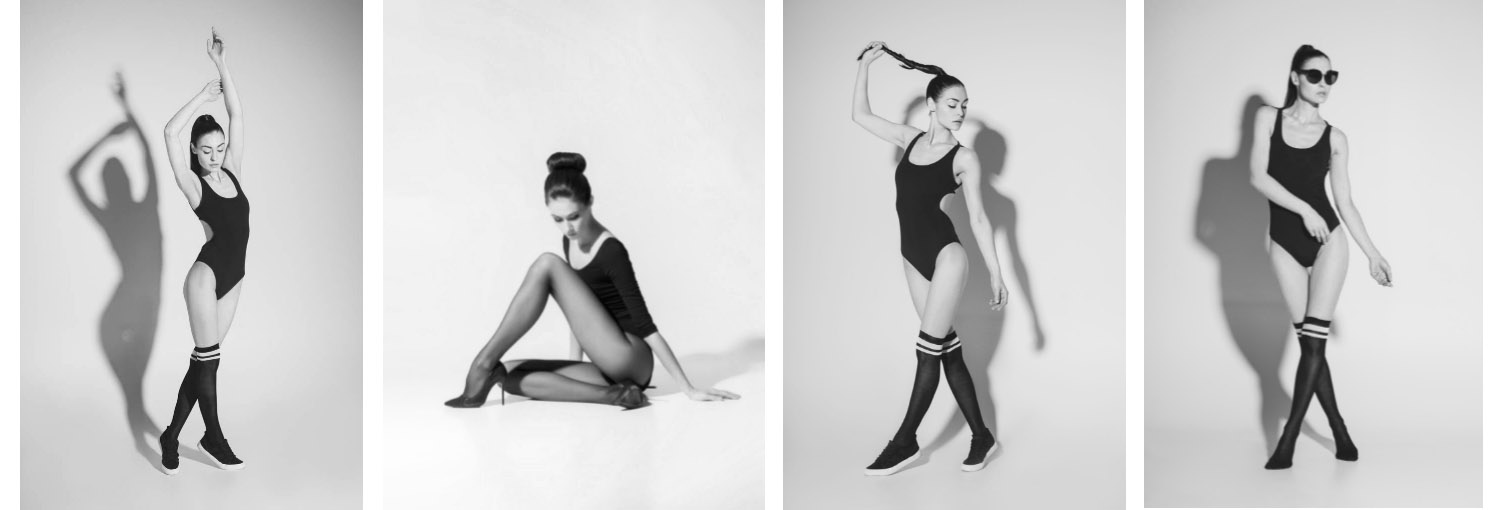 donna con body e calze nere in studio